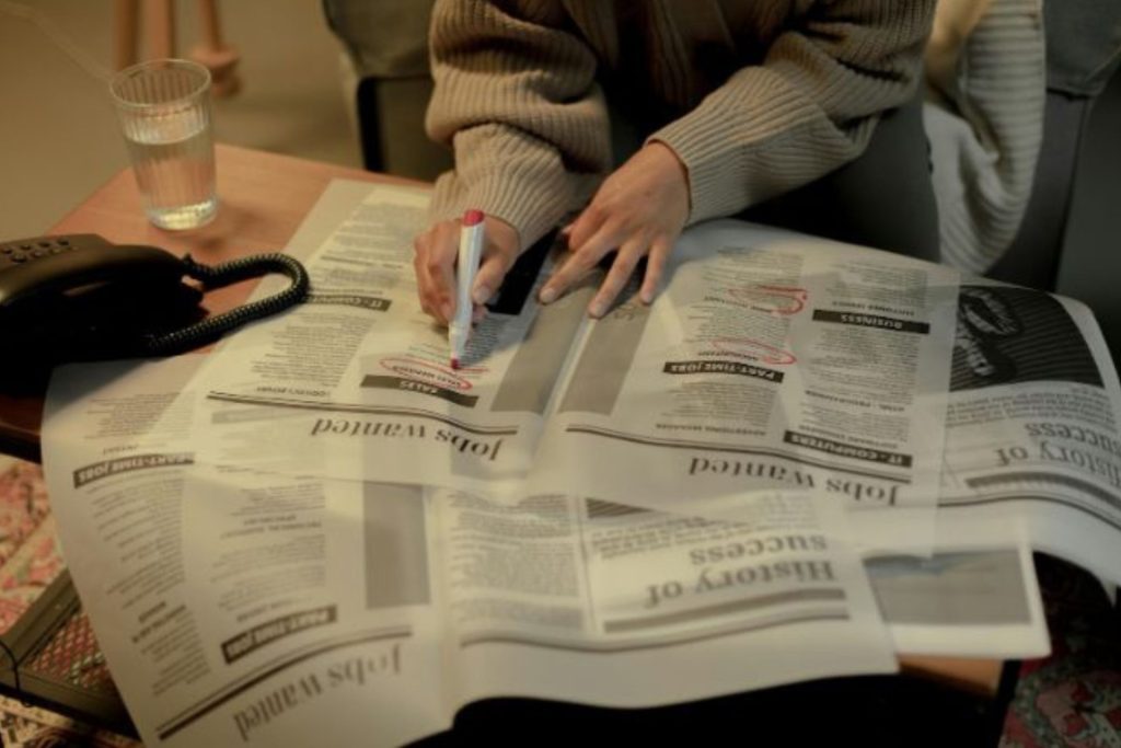 job searching in the newspaper