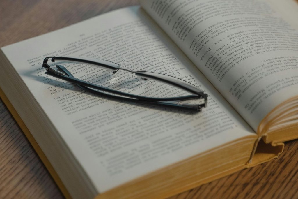 spectacles on a book