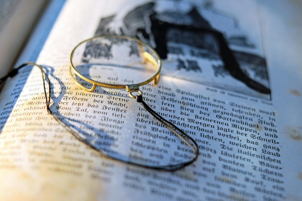 magnifying glass lying on book