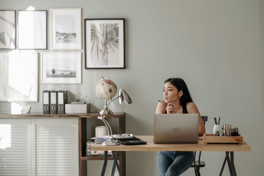 woman sitting at a work from home office desk