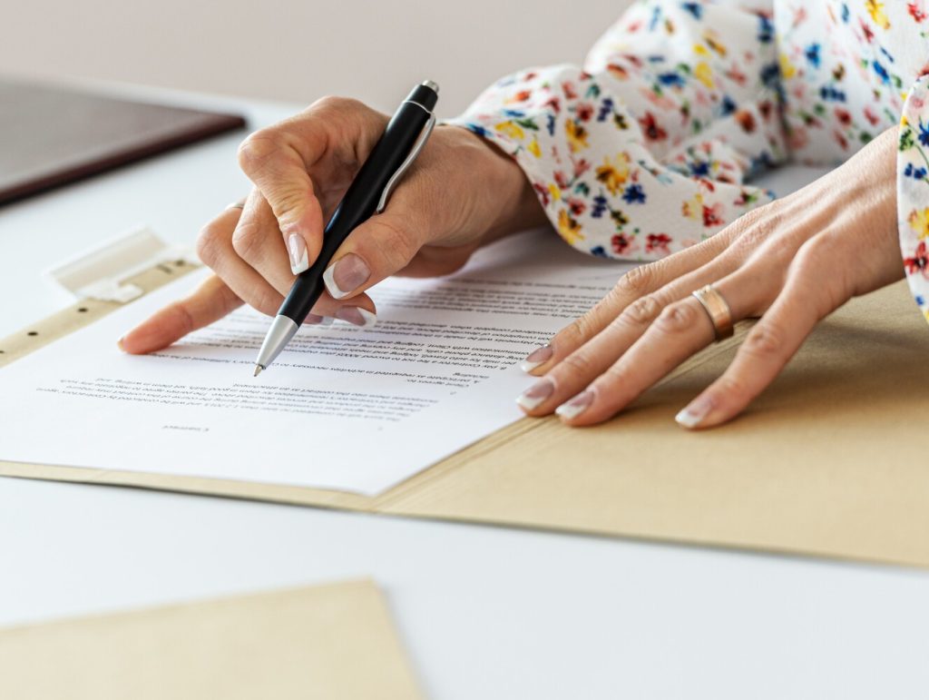 Businesswoman proofreading a contract