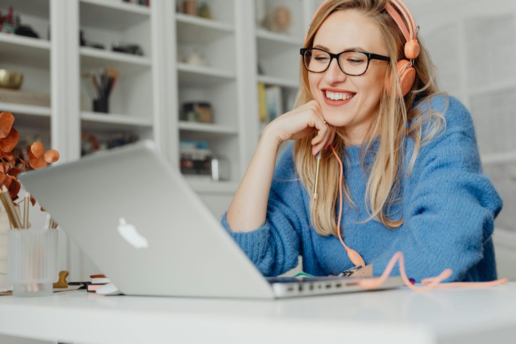 woman with headphones engaging online