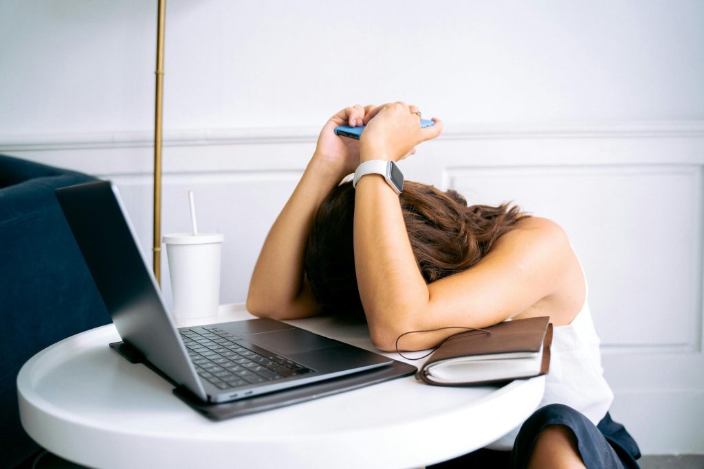 woman tired at her laptop