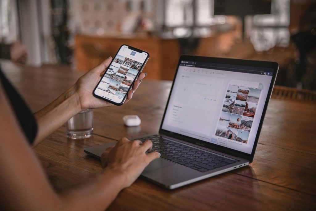 woman using smartphone and laptop as a proofreader