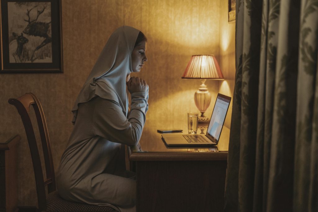 woman working on a computer in the dark