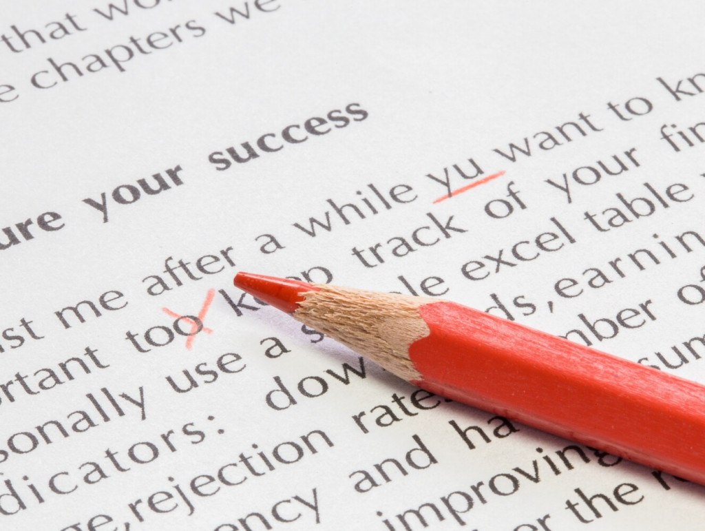 correcting text with a red pencil