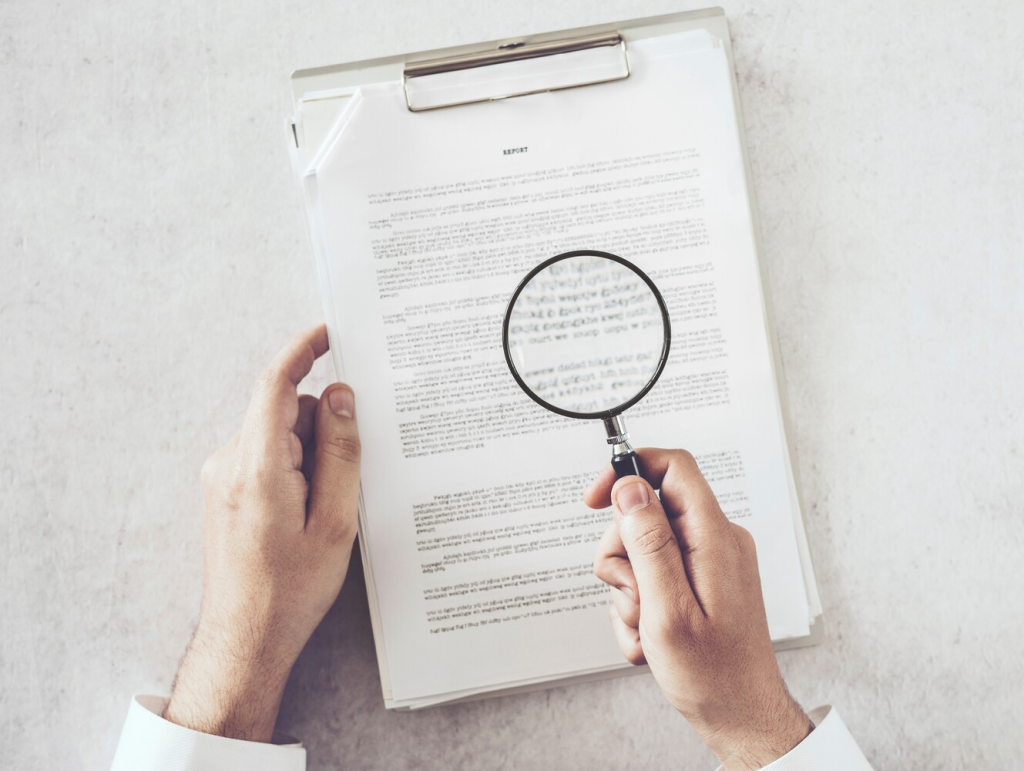 magnifying glass over text 